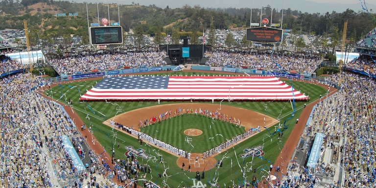 Fans of the Los Angeles Dodgers celebrate the opening day of the 2009 season at Dodger Stadium. (Click for higher-resolution version.) Image © 2009 by Andy Browncoat, used under the terms of the Creative Commons Attribution-Share Alike 2.0 Generic license.